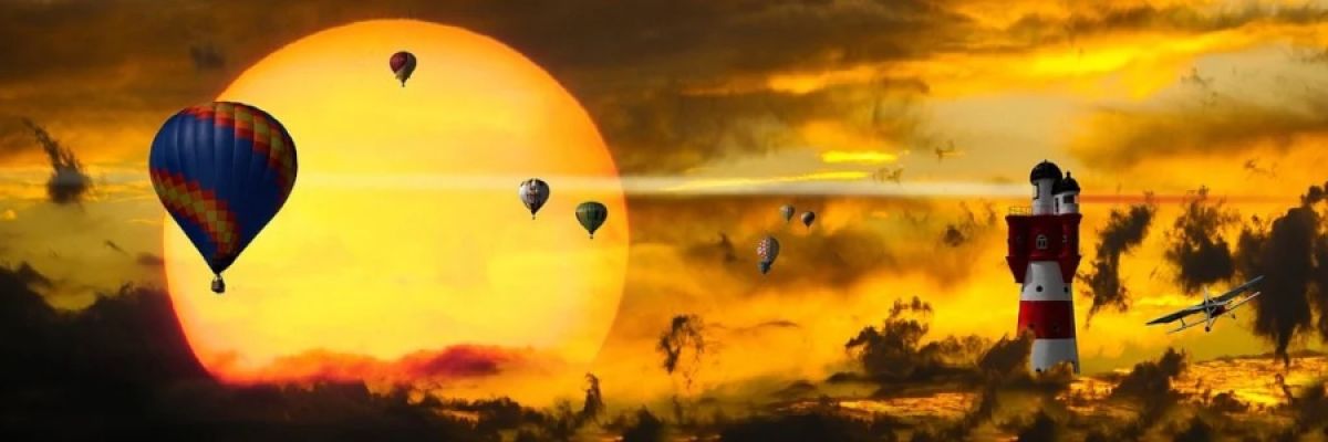 Un sol gigante y unos globos volando sobre el